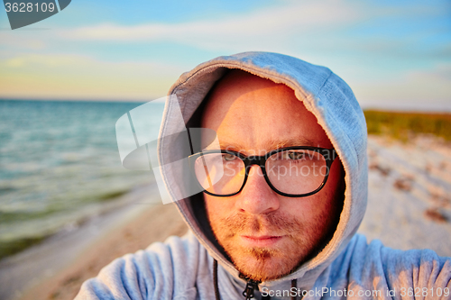 Image of Handsome man making selfie 