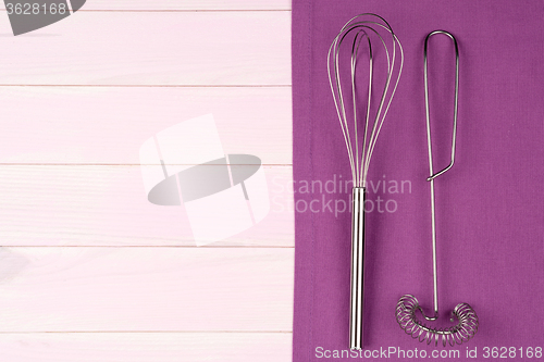 Image of Kitchenware on purple towel