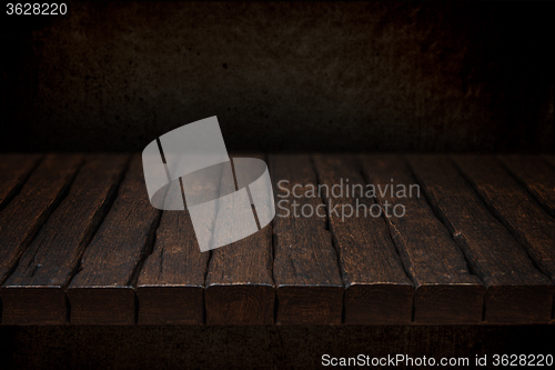 Image of Wooden top and dark space 