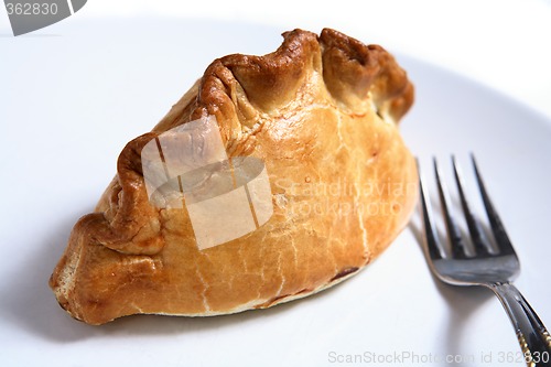 Image of Cornish pasty, fork, white plate