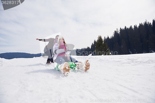 Image of happy young couple having fun on fresh show on winter vacation