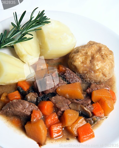 Image of English stew, dumplings and potatoes with rosemary