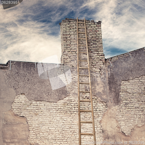 Image of abandoned grunge cracked brick stucco wall