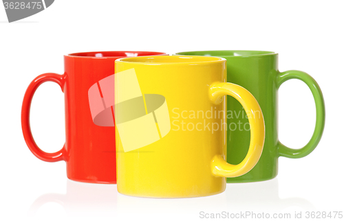 Image of Three colorful mugs for coffee or tea