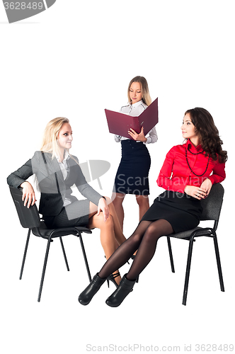 Image of Three confident businesswomen over white