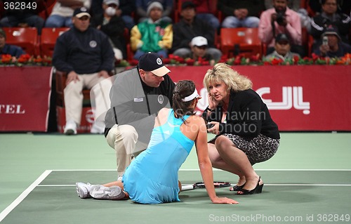 Image of Ana Ivanovic gets help after fall at Qatar Open