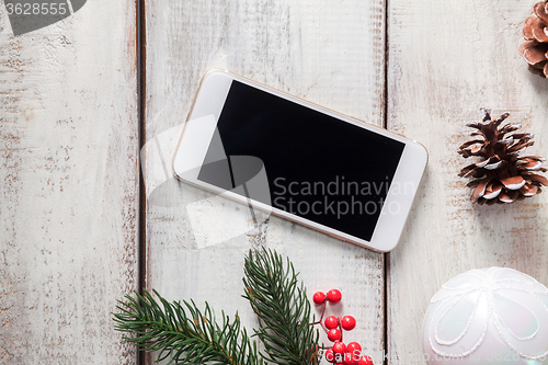 Image of The wooden table with a phone