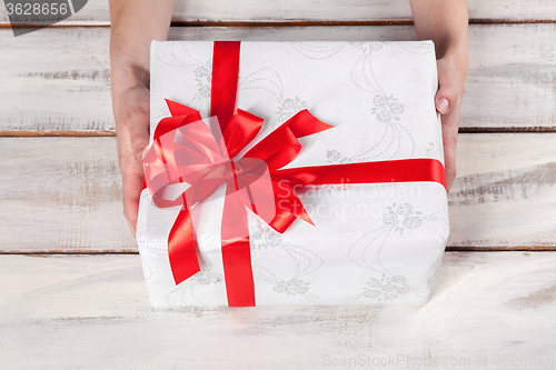 Image of The wooden table with Christmas gift