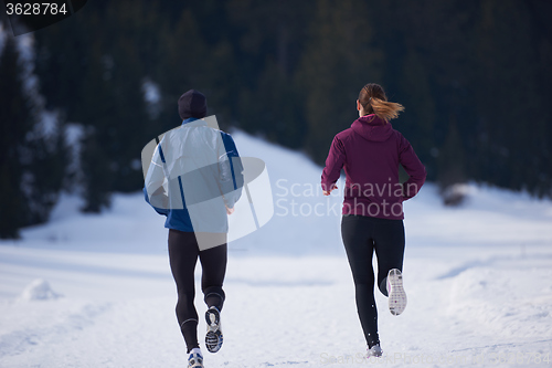 Image of couple jogging outside on snow