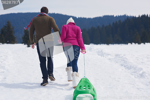 Image of happy young couple having fun on fresh show on winter vacation