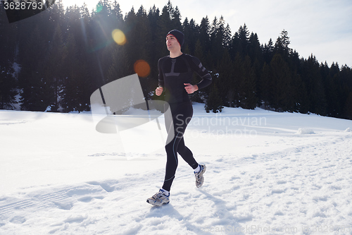 Image of jogging on snow in forest