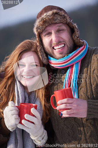 Image of couple drink warm tea at winter