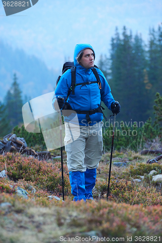 Image of advanture man with backpack hiking