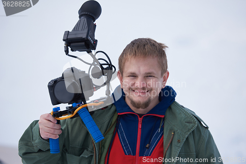 Image of couple having fun and walking in snow shoes