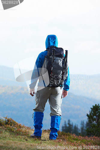 Image of advanture man with backpack hiking