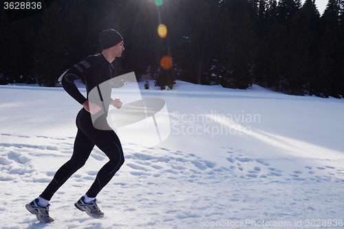 Image of jogging on snow in forest