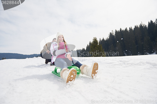 Image of happy young couple having fun on fresh show on winter vacation