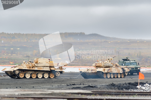 Image of Armoured recovery vehicle BREM-1M evacuates tank