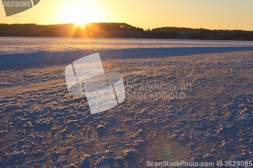 Image of Frozen lake sunset