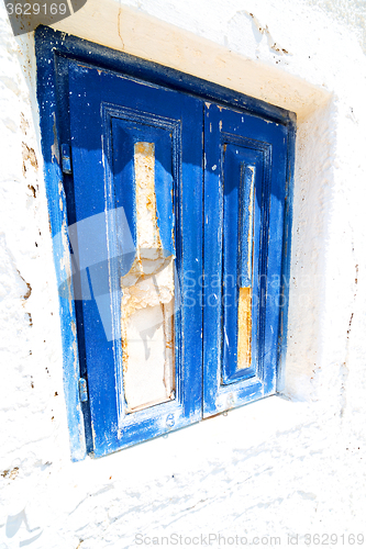 Image of blue door in antique  santorini greece   white wall