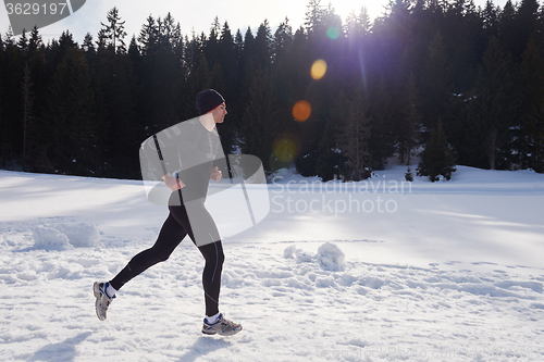 Image of jogging on snow in forest