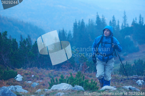 Image of advanture man with backpack hiking