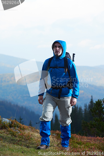 Image of advanture man with backpack hiking