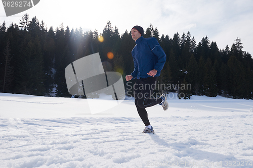 Image of jogging on snow in forest