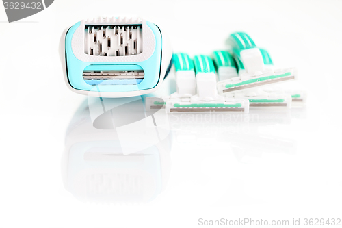 Image of depilator and razor