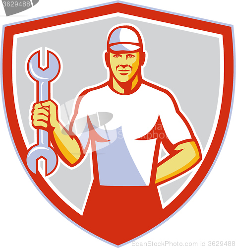 Image of Mechanic Holding Wrench Crest Retro