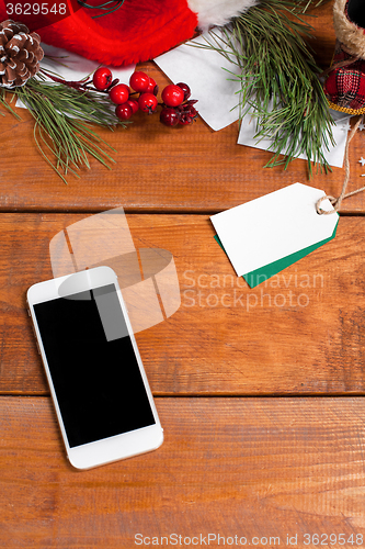 Image of The wooden table with a phone