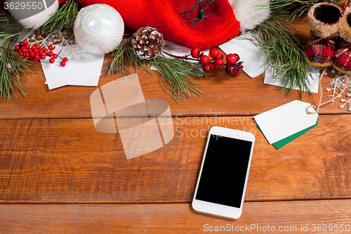 Image of The wooden table with a phone