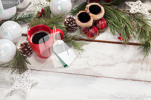 Image of The a cup of coffee on the wooden table 