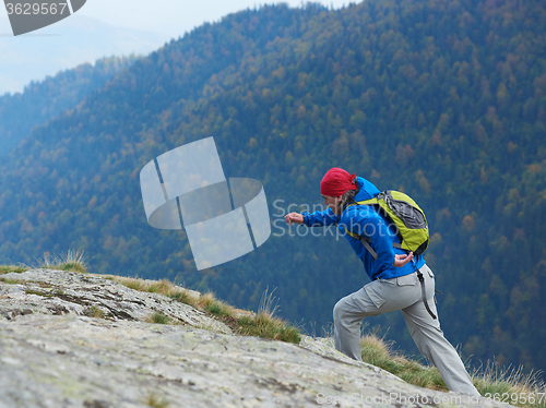 Image of advanture man with backpack hiking