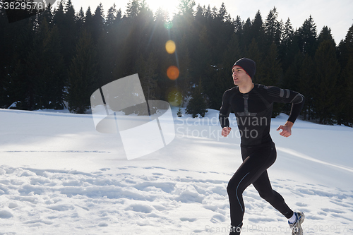 Image of jogging on snow in forest