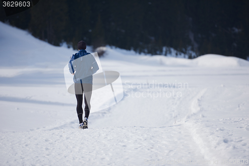 Image of jogging on snow in forest