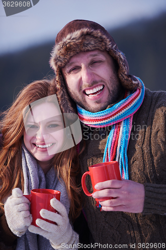 Image of couple drink warm tea at winter