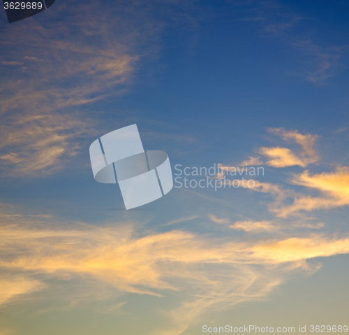 Image of the sunrise in  colored sky white soft clouds and abstract backg