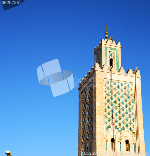 Image of history in maroc africa  minaret religion and the blue     sky