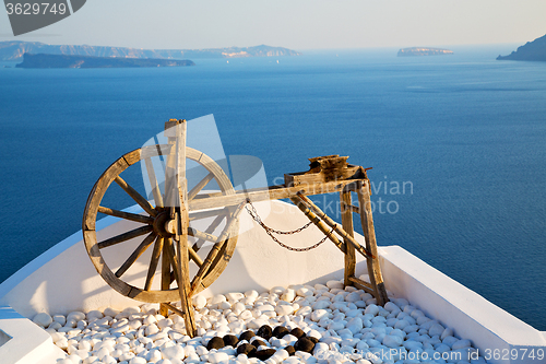 Image of greece in santorini  sea and spinning wheel