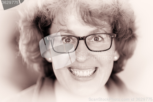 Image of Happy woman with glasses