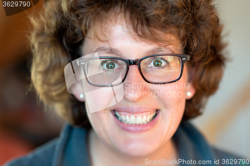 Image of Happy woman with glasses