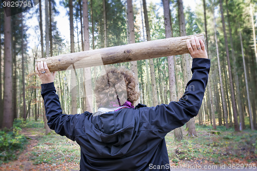Image of Woman fitness exercises in forest