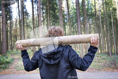 Image of Woman fitness exercises in forest