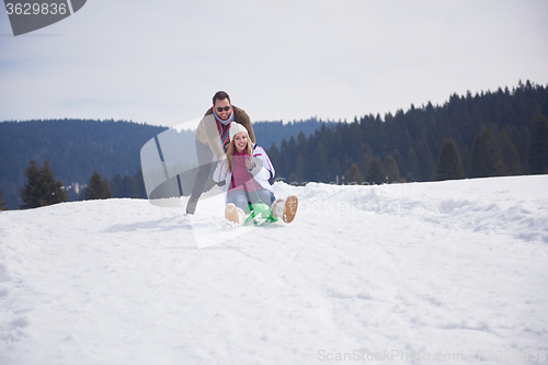 Image of happy young couple having fun on fresh show on winter vacation