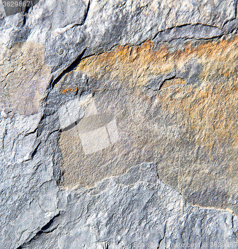 Image of rocks stone and red orange gneiss in the wall of morocco