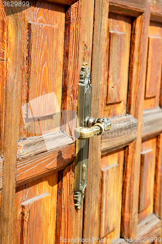 Image of stripped paint  door    in italy   ancian  texture nail