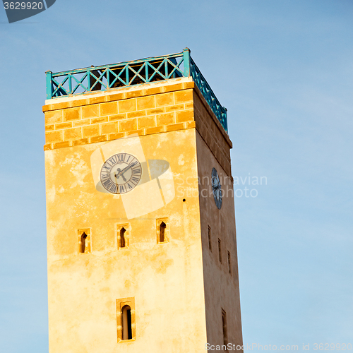 Image of old brick tower in morocco africa village and the sky