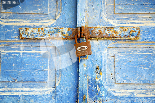 Image of morocco in africa the sand  rusty safe padlock 
