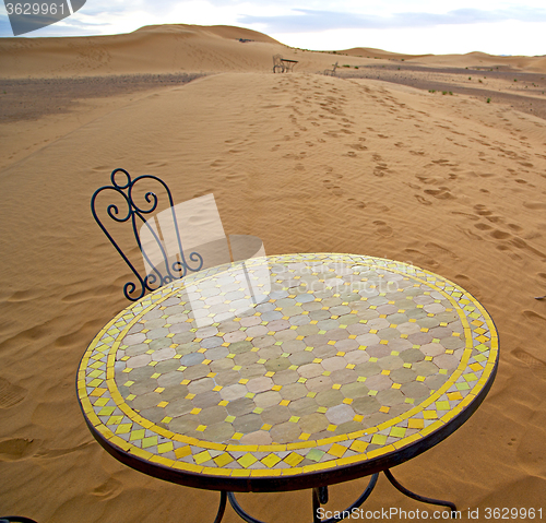 Image of table and seat in desert  sahara morocco    africa yellow sand